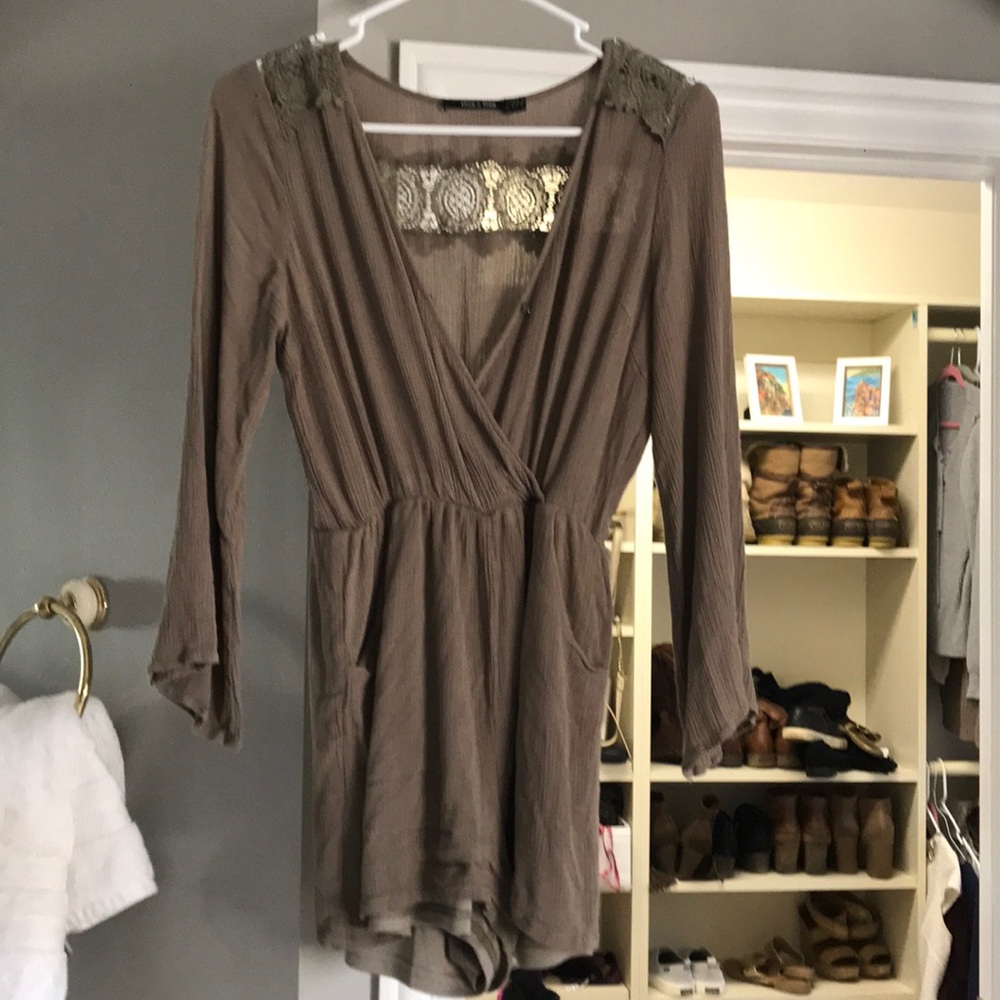 Adorable forest green romper with detailing on bac